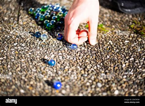 Playing Marbles Old Childrens Game Colorful Balls Stock Photo Alamy