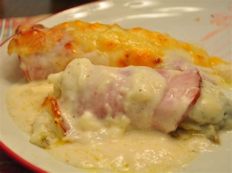Chicons Au Gratin Is A Classic Belgian Dish Made Of Endives Rolled In Ham And Bathed In Mornay