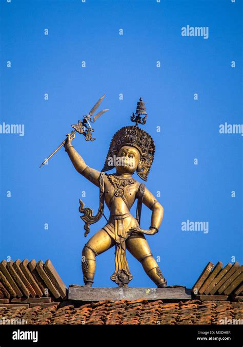 a statue of the hindu deity hanuman atop the hanuman dhoka an old royal palace in durbar square
