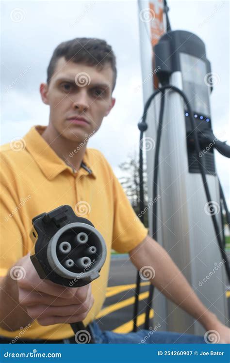 Man Charging His Electric Vehicle Stock Image Image Of Battery