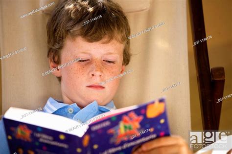 Boy Reading A Book Stock Photo Picture And Rights Managed Image Pic