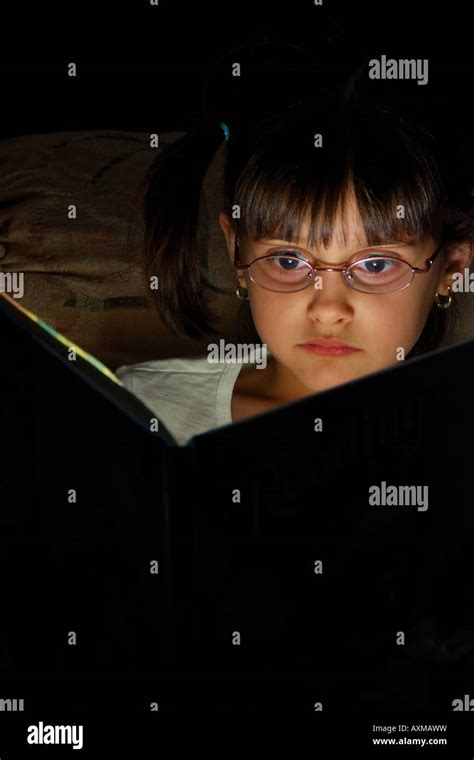 Girl Reading Magic Book Stock Photo Alamy