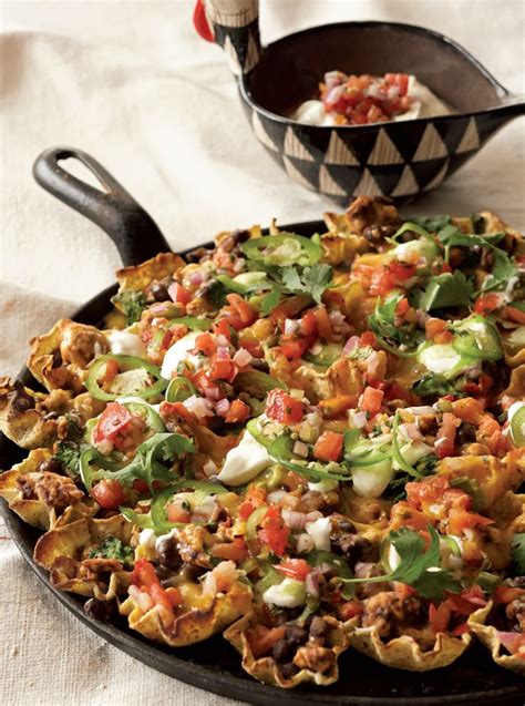 Crispy tortilla chips are topped with seasoned chicken, cheese, pico de gallo, and other favorite nacho toppings. Rocco's Loaded Nachos with Turkey, Black Beans and Salsa ...
