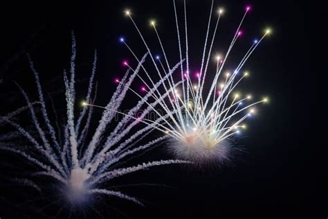 Smoke Of A Colorful Burst Of Fireworks In The Night Sky Stock Image