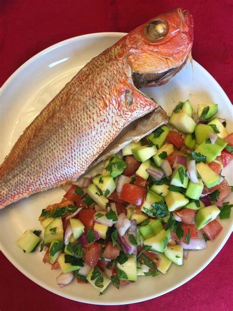 Insert fresh minced garlic into the slits and also inside the fish cavity (the cleaned gut.) 2. Baked Whole Red Snapper Recipe - Melanie Cooks