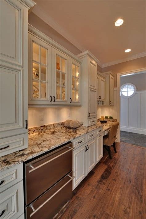 A traditional kitchen with cream cabinets is getting a little facelift! I am really starting to like cream colored cabinets. I ...
