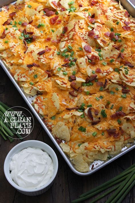 Layer the potatoes on the bottom of a heavy skillet or a serving dish and top with half of the cheese mixture. Loaded Baked Potato Nachos | A Clean Plate