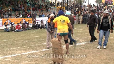 Old Man Lifts Heavy Sack In India Rural Weight Lifting Challenge