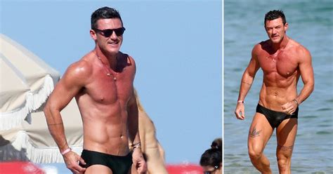 Luke Evans Shows Off Chiseled Body In Tiny Speedo On Miami Beach Gets Cozy With Mystery Man