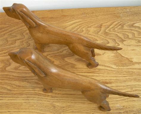 Antiques Atlas 2 Carved Wooden Dogs