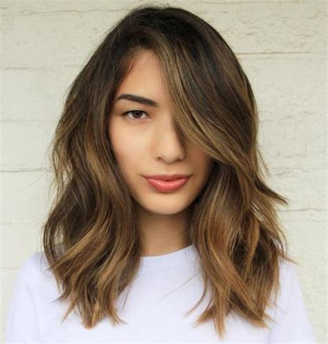 Our fresh pick of trendy hairstyles for long faces will help you diversify your hair routine and embrace your face shape, no strings attached. 60 Super Chic Hairstyles for Long Faces to Break Up the Length