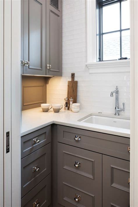 This tile's durability has a p.e.i. Taupe painted cabinets + Chelsea Gray by Benjamin Moore + White Subway Tile | John Kraemer & Son ...