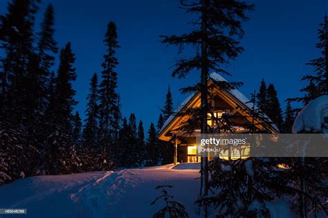 Wooden Cottage Log Home Log Cabin In Winter At Night High Res Stock