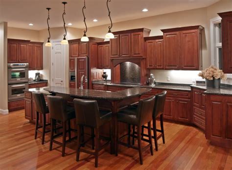 With the contrast between the different types of material in the cabinets and countertops, any kitchen can be transformed with a deep wooden color in the floors. 34 Kitchens with Dark Wood Floors (Pictures)