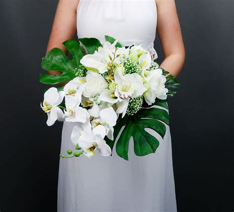 High quality, realistic artificial flowers. Tropical wedding bouquet with white orchids and greenery ...