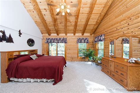 Spacious Master Bedroom In Timber Framed Home With Pine Board Walls