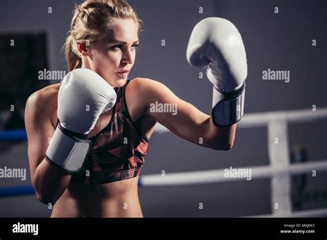 Female Boxer Wearing Gloves Posing In Boxing Studio Stock Photo Alamy