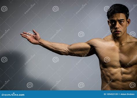 Fitness Model Stretching Out Arm Stock Image Image Of Shirtless