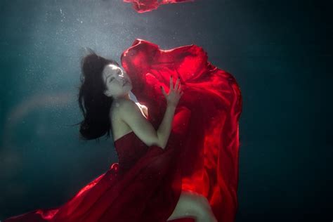 Free Photo Young Woman Posing Submerged Underwater In A Flowy Dress