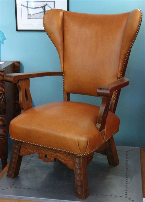 How about a caramel leather chair? Oak and caramel leather wing chair For Sale at 1stdibs