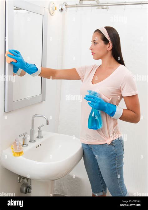 Young Woman Cleaning Bathroom Stock Photo Alamy