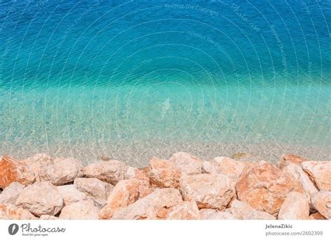 Rocks And Turquoise Water Background A Royalty Free Stock Photo From