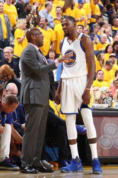 Mike Brown And Kevin Durant Of The Golden State Warriors Talk During The Game Against The