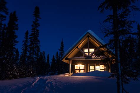 Wooden Cottage Log Home Log Cabin In Winter At Night Stock