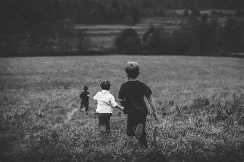 Photo Of Children Running Through A Field