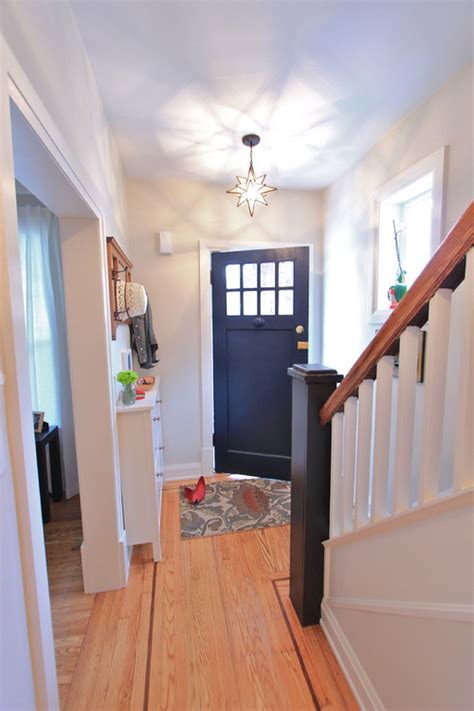 In this entryway designed by the inky pigment and sharp angles of the light fixtures and graphic area rugs assert a modern edge keep it small but mighty. 8 Ways To Enhance A Small Foyer