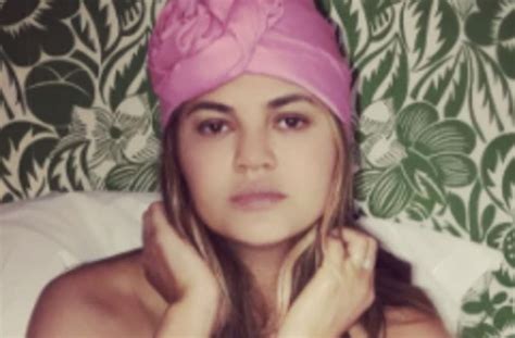 chrissy teigen rolls around in bed sheets completely naked on instagram