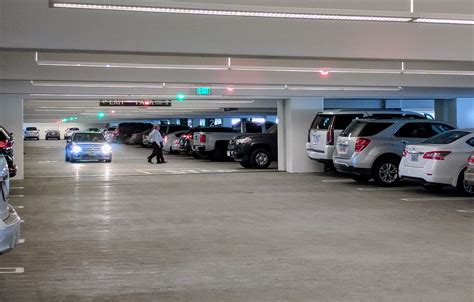 This Parking Garage Uses Green And Red Lights On The Ceiling In Each