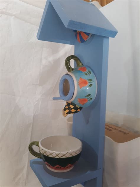 The results are pretty interesting! Orange Tulips Teapot Birdhouse - Teapot Birdhouses