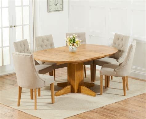 It can be a small table when it's just you and your family eating, but once guests come or if you're laying on a buffet, it instantly becomes a large kitchen table, which is the perfect way to have an entertaining table without it taking up too. 20 Best Collection of Round Extending Oak Dining Tables ...