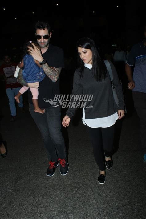 Sunny Leone And Husband Daniel Weber Snapped With Daughter Nisha At Airport