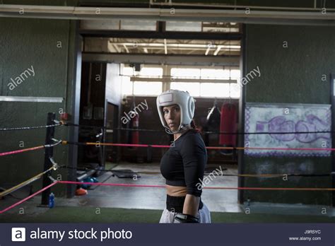Portrait Tough Female Boxer Looking Away In Boxing Ring Stock Photo Alamy