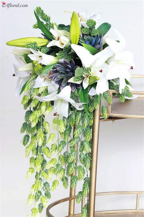 We offer all things weddings, parties and crafts. Tropical Bouquet Filled with Greenery and Succulents ...