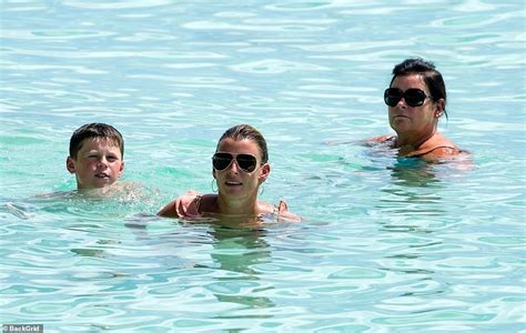 Coleen Rooney Shows Off Her Curves In A Black Bikini While Soaking Up The Sun In Barbados