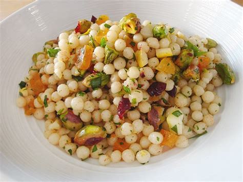 When the couscous has cooled, stir in the mint, pomegranate arils, pistachios, zest, and juice. Lemon-pistachio Israeli couscous (Couscous Israélien au ...