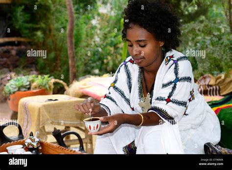 An Ethiopian Woman Preforming A Traditional Coffee Ceremony Stock Photo