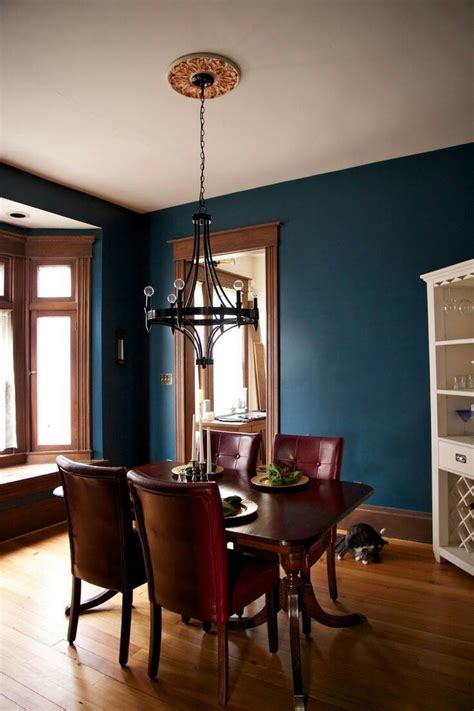 While many of the best colors to pair with medium to dark wood trim are whites or neutrals, that doesn't mean you can't add in a color, too. Blue traditional dining room with natural wood trim ...