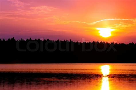 Beautiful Pink Sunset Over Lake Stock Photo Colourbox