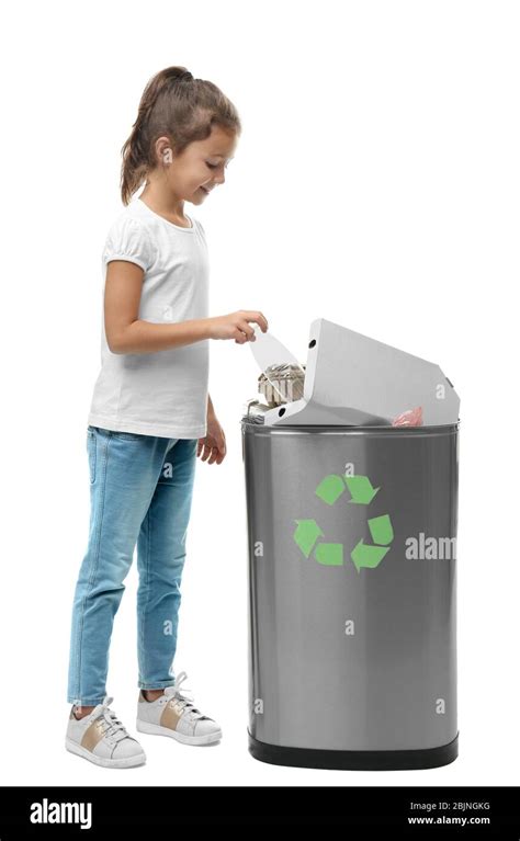 Little Girl Throwing Garbage Into Litter Bin On White Background
