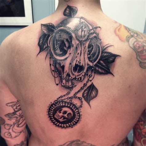 Abdominal, black ink, cat skull, front, girls skull, jake ross, sternum. Cat skull tattoo