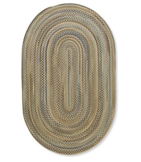 The Oval Rug Is Made From Braiding And Has An Oval Shape On Top Of It