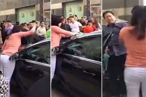 Watch As Furious Wife Smashes Cheating Husbands Car With Her Bare Hands After Discovering