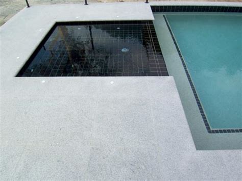 Maybe you would like to learn more about one of these? Light Grey Granite Stone pool pavers surround this pool