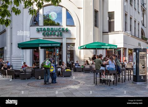 People Drinking Coffee Outside Starbucks Coffe Shop Kudamm Berlin