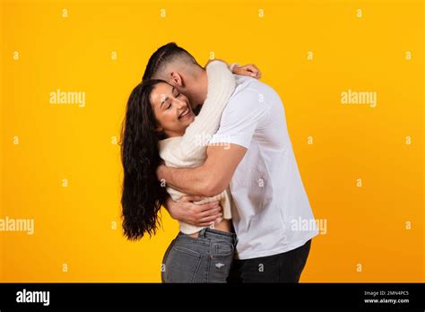 Satisfied Young Arabic Husband Hugging Wife Enjoy Tender Moment Time Together Have Fun Stock
