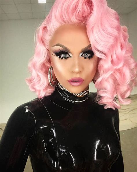 A Mannequin With Pink Hair Wearing Black Latex